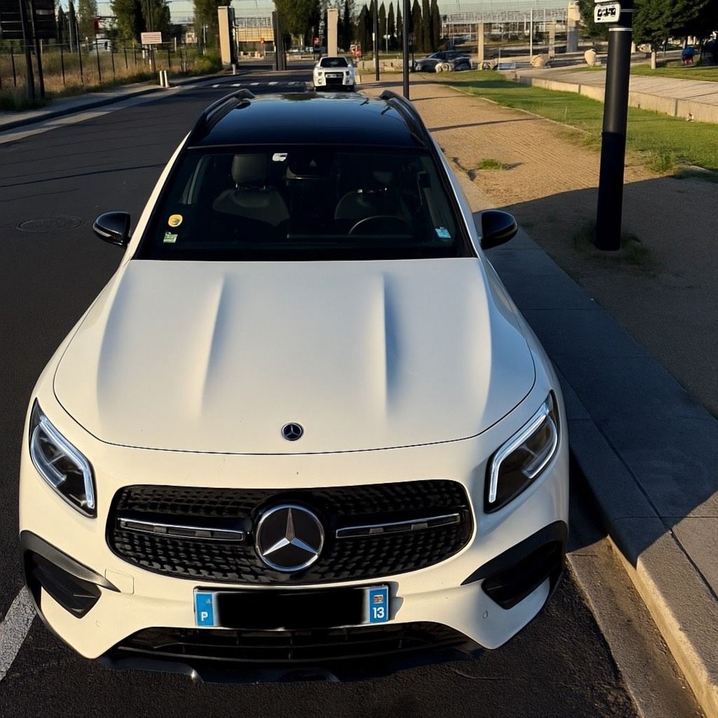 Taxi 4x4x white Mercedes in front of TGV station