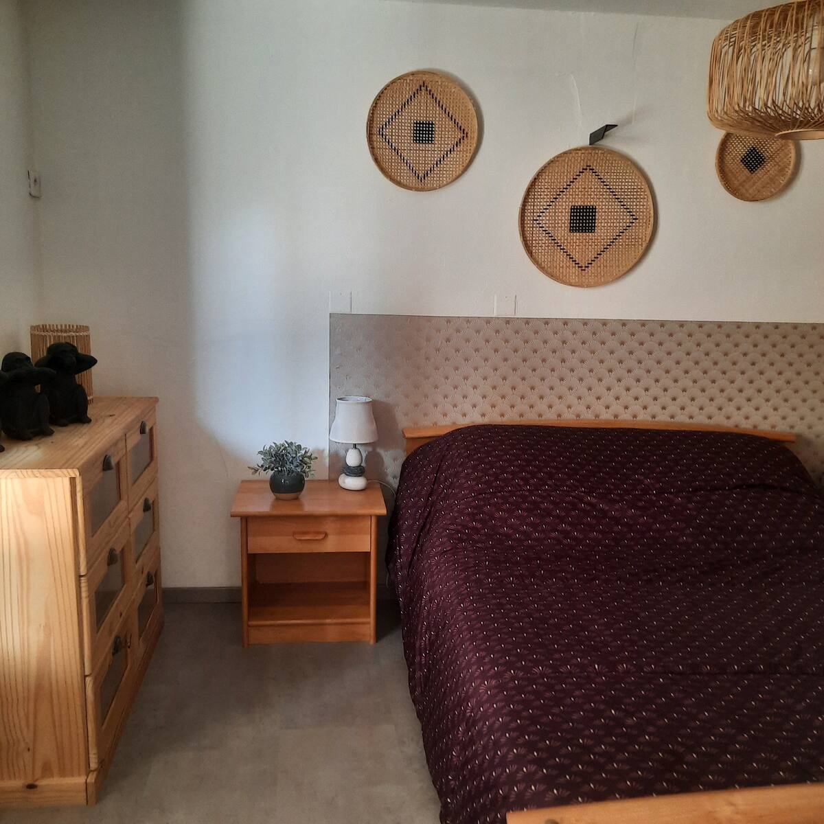 Room decorated simply with a double bed.
