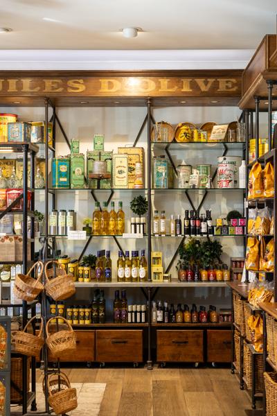 Various products and Provençal specialties on a wooden shelf 