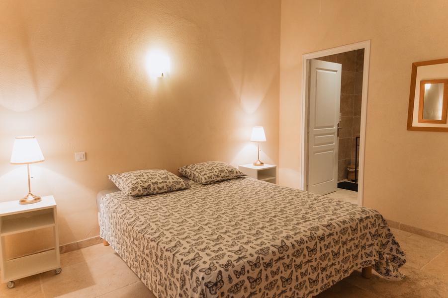 Single beige double bedroom.