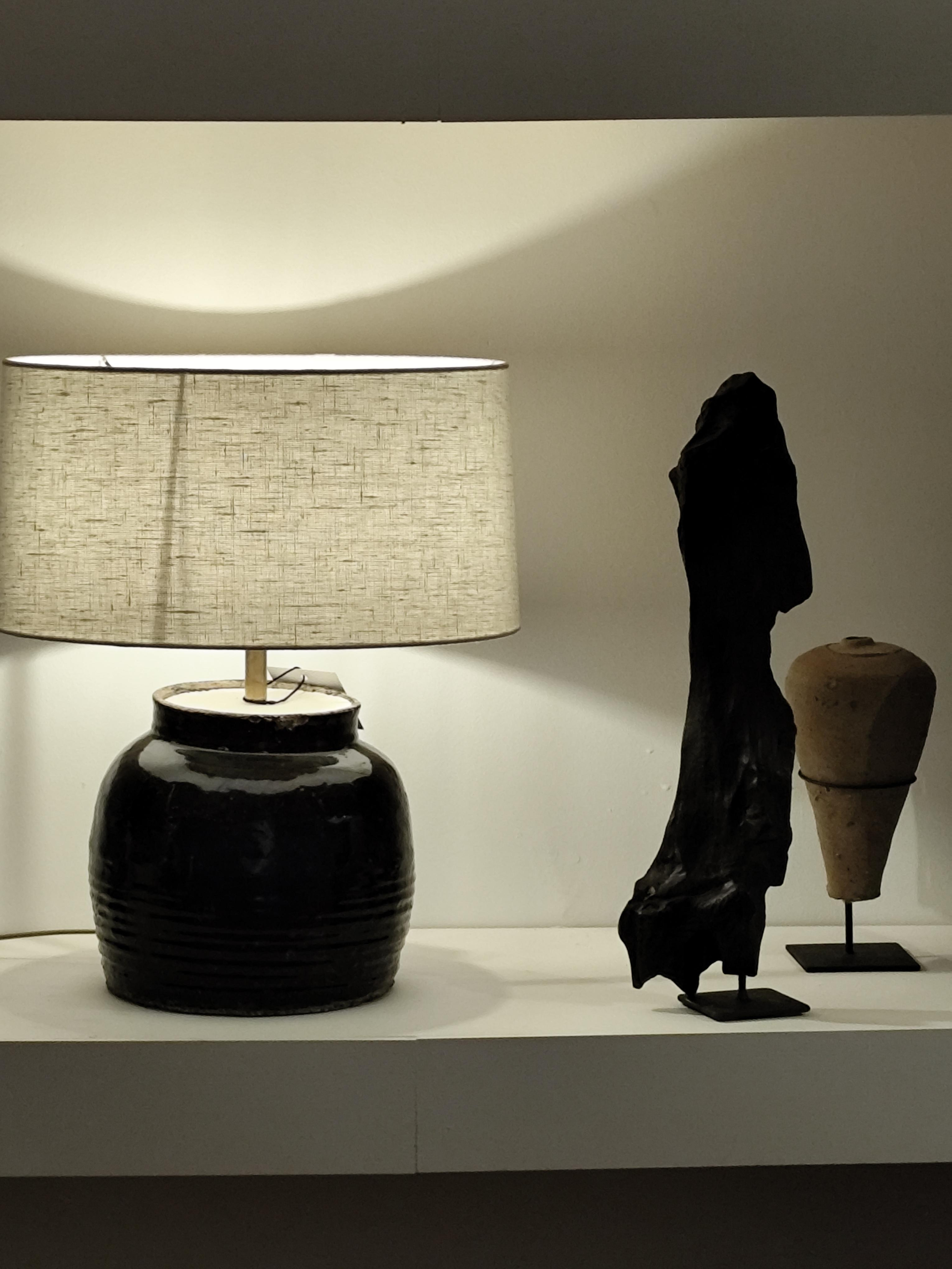 beige lamp and wood and ceramic sculptures