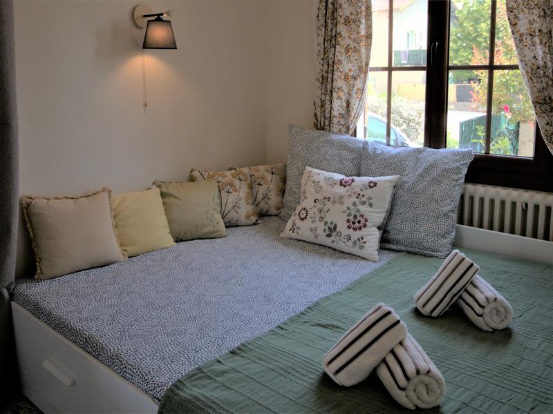 Cosy bed by the window 